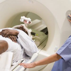 Person going through medical imagining scanner