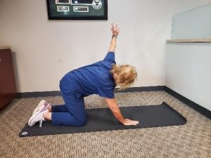 Dynamic Stretch: Thoracic Rotational Reach Through