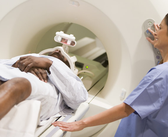 Person going through medical imagining scanner